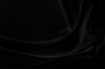 Black gray satin dark fabric texture luxurious shiny that is abstract silk cloth background with patterns soft waves blur beautiful.