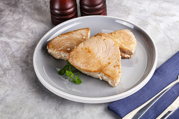 Roasted red tuna steak in the plate