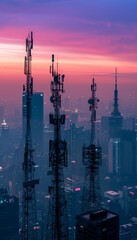 Fototapeta premium Early Morning Cityscape with Mobile Network Towers Against a Foggy Skyline