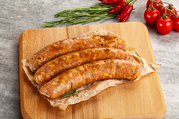 Raw sausages with spices and herbs