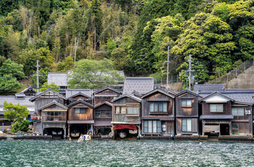 Beautiful scenic view with the wooden traditional waterfront boat houses called funaya around Ine Bay, in the village Ine, Japan