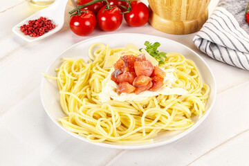 Pasta spaghetti with salmon and stracciatella