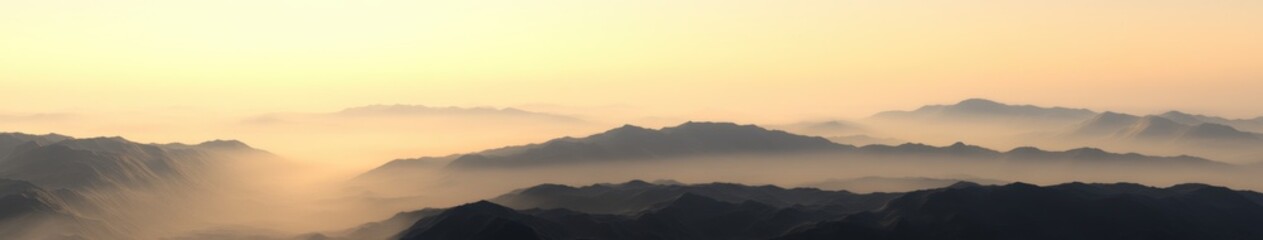 Foggy mountains during evening light