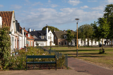 Small houses around a lawn in the center of Renesse in the province of Zeeland.