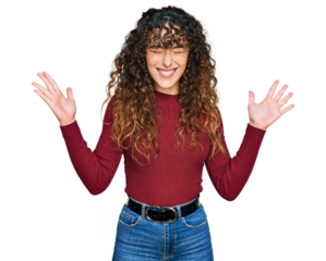 Young hispanic girl wearing casual clothes celebrating mad and crazy for success with arms raised and closed eyes screaming excited. winner concept