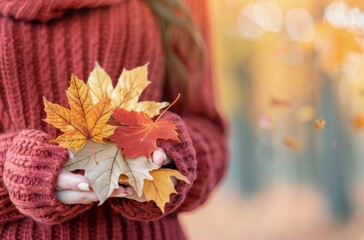 Woman Holding Colorful Autumn Leaves in a Forest During Fall