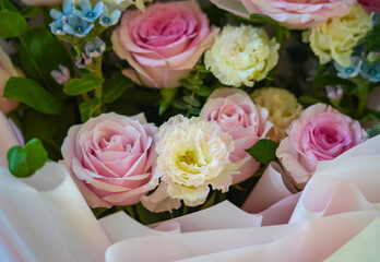 fresh colorful roses in a bouquet as background