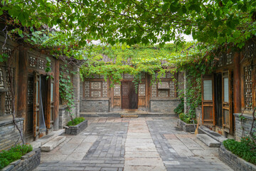 Naklejka premium ancient Chinese style house building and backyard