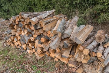 Small wood stack stacked wood pile firewood on ground