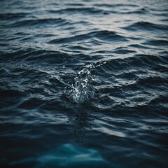 Obraz premium Deep blue ocean waves crashing against rugged cliffs, with dramatic skies and a distant horizon adding to the scene