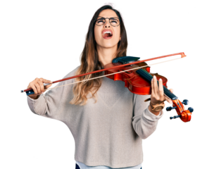 Beautiful hispanic woman playing violin angry and mad screaming frustrated and furious, shouting with anger looking up.