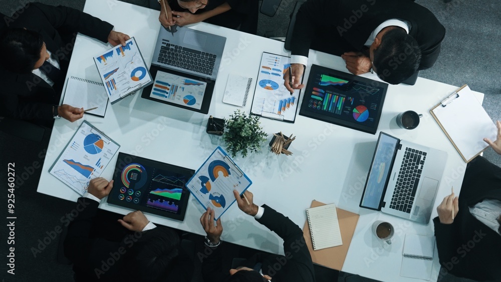 Poster top down aerial view of business people discussing about financial strategy on table with document a