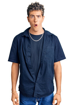 Young handsome man wearing casual clothes scared and amazed with open mouth for surprise, disbelief face