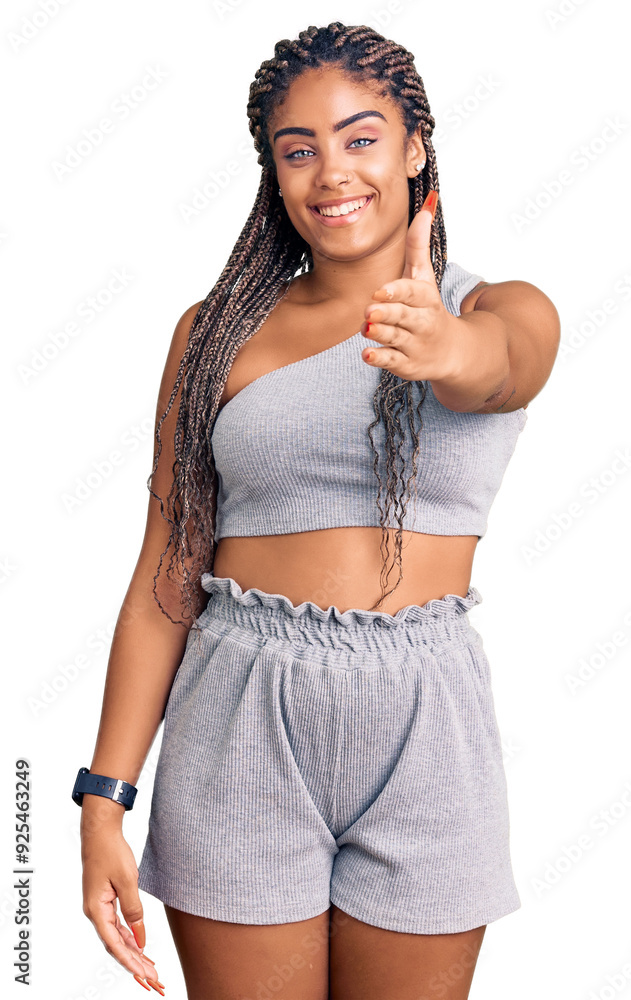 Canvas Prints Young african american woman with braids wearing sportswear smiling friendly offering handshake as greeting and welcoming. successful business.