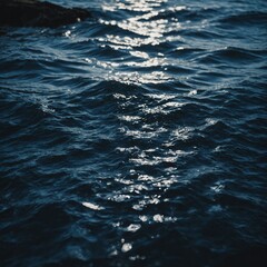 Gentle waves lapping at a pristine beach, with the warm hues of twilight casting a soft glow over the tranquil scene