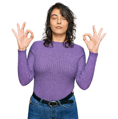 Young hispanic woman wearing casual clothes relax and smiling with eyes closed doing meditation gesture with fingers. yoga concept.