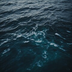 Fototapeta premium Shimmering surface of a quiet river at dusk with the last light of day reflecting off the water