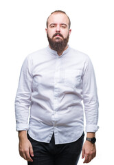 Fototapeta premium Young caucasian hipster man over isolated background with serious expression on face. Simple and natural looking at the camera.