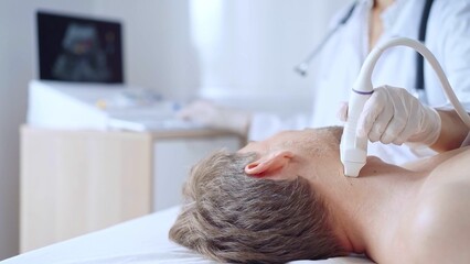 Doctor woman wearing white medical coat performing neck ultrasound exam on male patient. Medicine service concept
