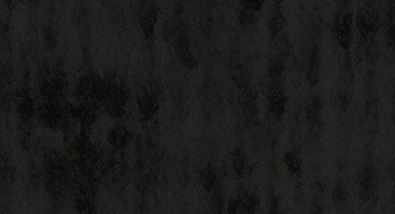 Obraz premium Black background made of real, shiny black paper covered with foil, illuminated by a soft light from above. 