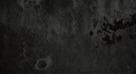 Black background made of real, shiny black paper covered with foil, illuminated by a soft light from above.	