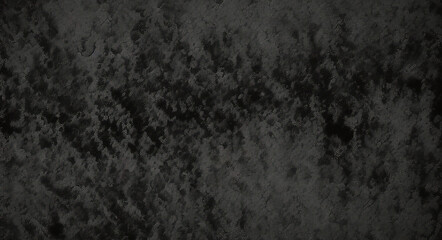 Obraz premium Black background made of real, shiny black paper covered with foil, illuminated by a soft light from above. 