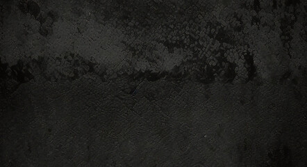 Black background made of real, shiny black paper covered with foil, illuminated by a soft light from above.	