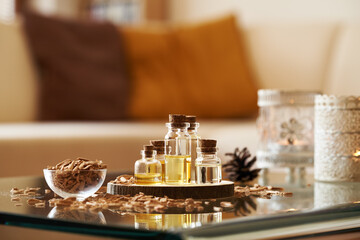 Bottles of cedar wood aromatherapy essential oil for sleep in a living room