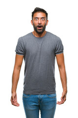 Fototapeta premium Adult hispanic man over isolated background afraid and shocked with surprise expression, fear and excited face.