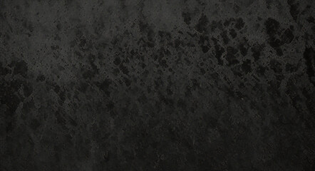 Black background made of real, shiny black paper covered with foil, illuminated by a soft light from above.	