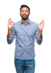Fototapeta premium Adult hispanic man over isolated background relax and smiling with eyes closed doing meditation gesture with fingers. Yoga concept.