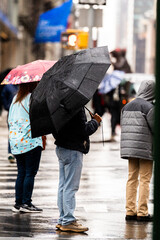 people walking in rain