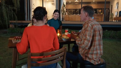 Family gather celebrate holiday. Parents, grandparents and girl together to talk and have dinner...