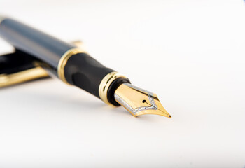 Fountain pen, beautiful fountain pen positioned on white background, selective focus.