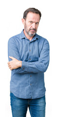 Handsome middle age elegant senior man over isolated background skeptic and nervous, disapproving...