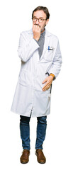 Fototapeta premium Middle age doctor men wearing medical coat looking stressed and nervous with hands on mouth biting nails. Anxiety problem.