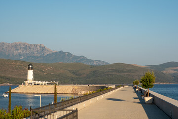 Lighthouse on a sunny day in luxury village of Montenegro on Adriatic coast.