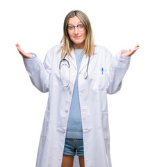 Young beautiful doctor woman headphones over isolated background clueless and confused expression with arms and hands raised. Doubt concept.