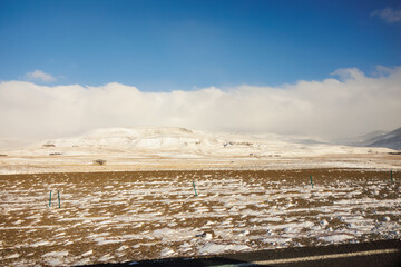Icelandic region wintery surroundings includes snow covered peaks and frozen pastures. Highlands, slopes and winter paradise adventure scene compose the picturesque setting.