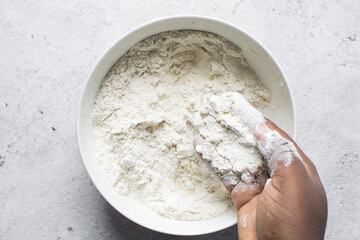 butter and flour being mixed together, butter and flour mixed into rough pastry, butter and flour...
