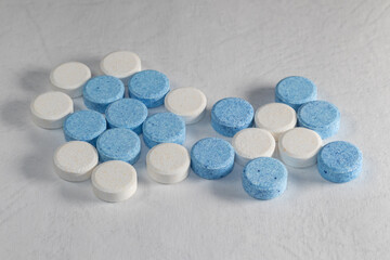 Colorful pills on white background, motion blur and focused pills.