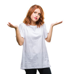 Young beautiful woman over isolated background clueless and confused expression with arms and hands...