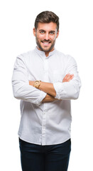 Young handsome man over isolated background happy face smiling with crossed arms looking at the camera. Positive person.