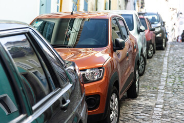 Several cars parked on a street in Pelourinho, historic center of Salvador, Bahia.