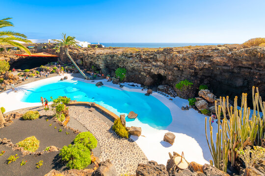 The swimming pool of the C&eacute;sar Manrique Volcano House near the Atlantic Coast at Jameos del Agua, in Haria Spain on the Canary Island of Lanzarote.
