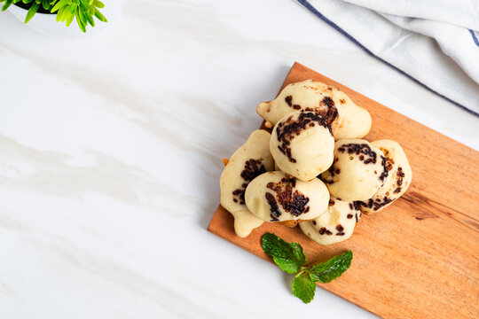 Kue Cubit. Indonesian version of Dutch poffertjes; topped with chocolate sprinkles. Perfect for design element, product packaging, promotion, or any commercial purposes.