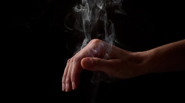 hands with palo santo smoke, incense, meditation, alternative therapies