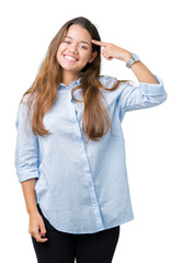 Fototapeta premium Young beautiful brunette business woman over isolated background Smiling pointing to head with one finger, great idea or thought, good memory