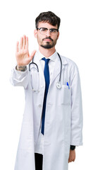 Young doctor man wearing hospital coat over isolated background doing stop sing with palm of the hand. Warning expression with negative and serious gesture on the face.