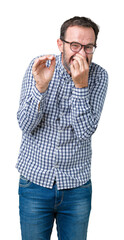 Handsome middle age elegant senior business man wearing glasses over isolated background smelling...